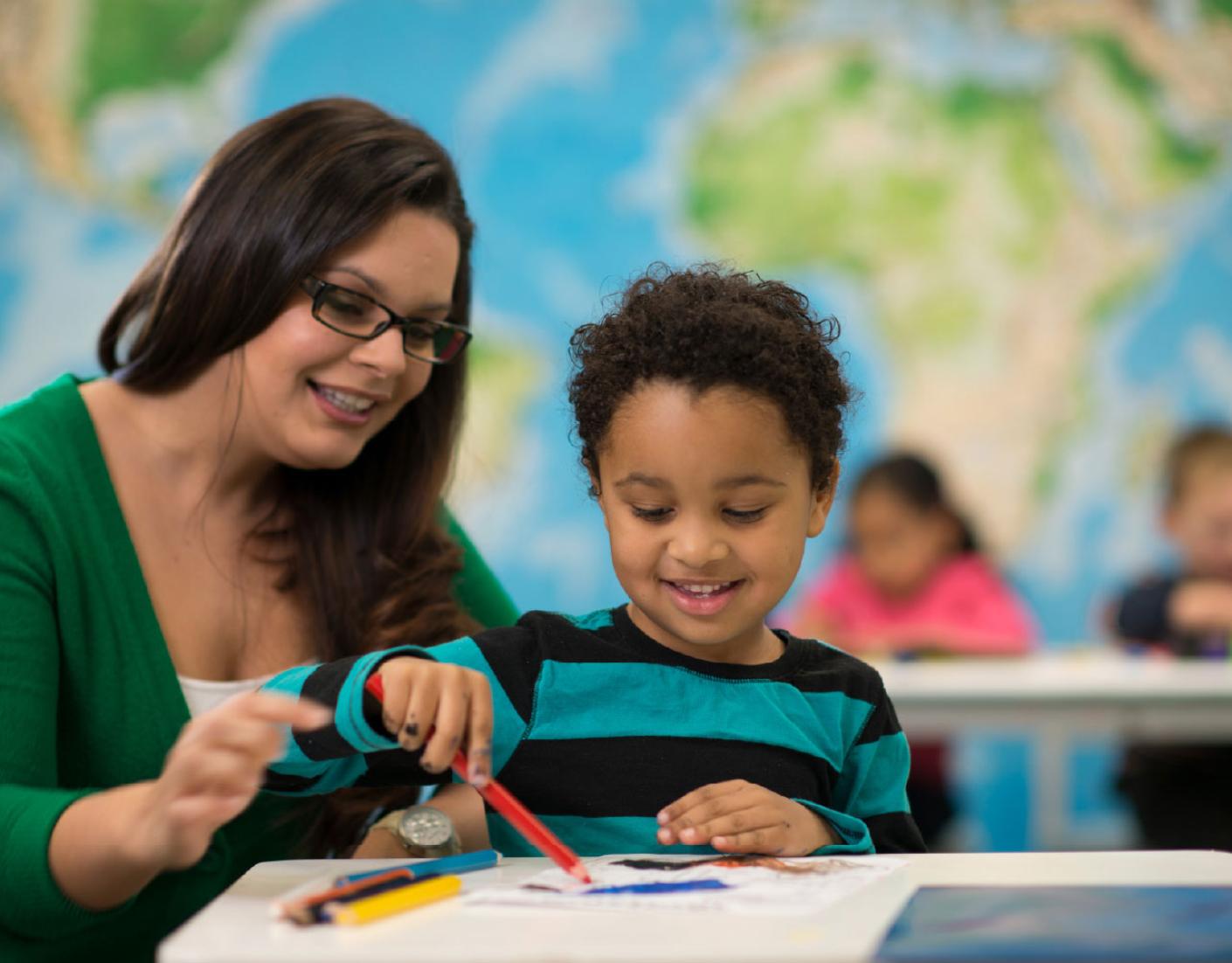 woman and little boy drawing
