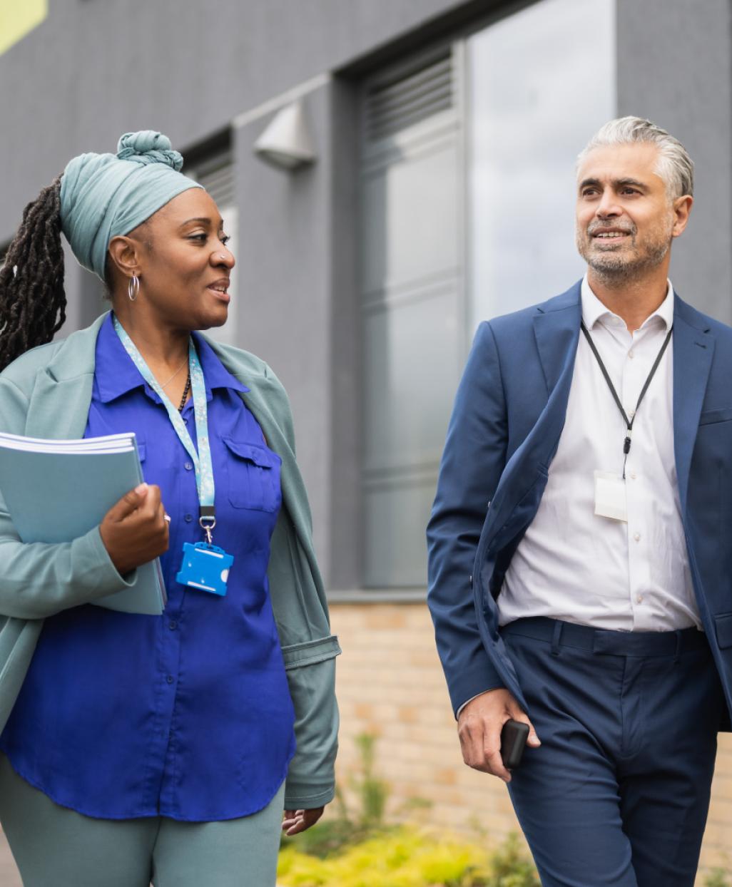 two healthcare professionals walking
