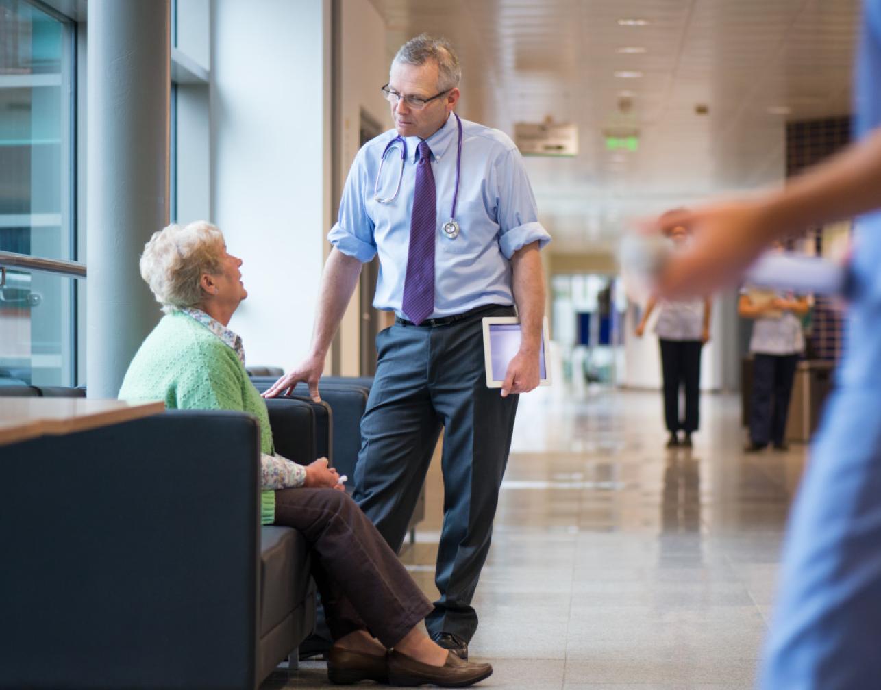 health professional speaking to elderly lady