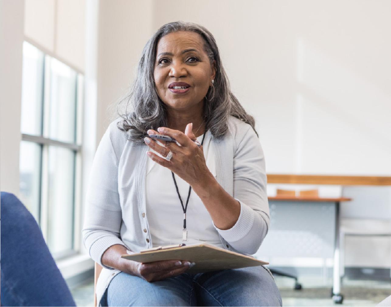 a woman with a clipboard and pen