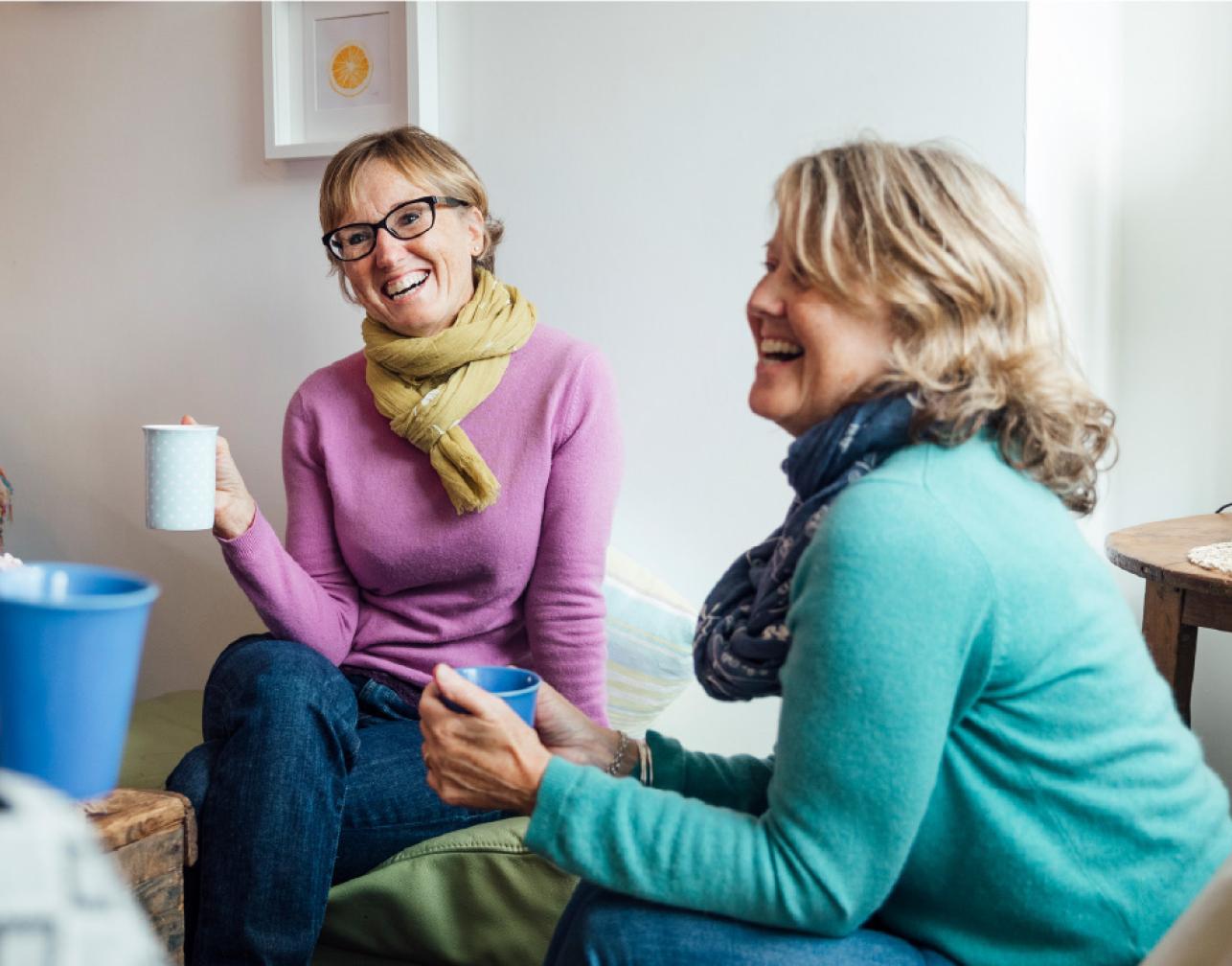 two woman laughing